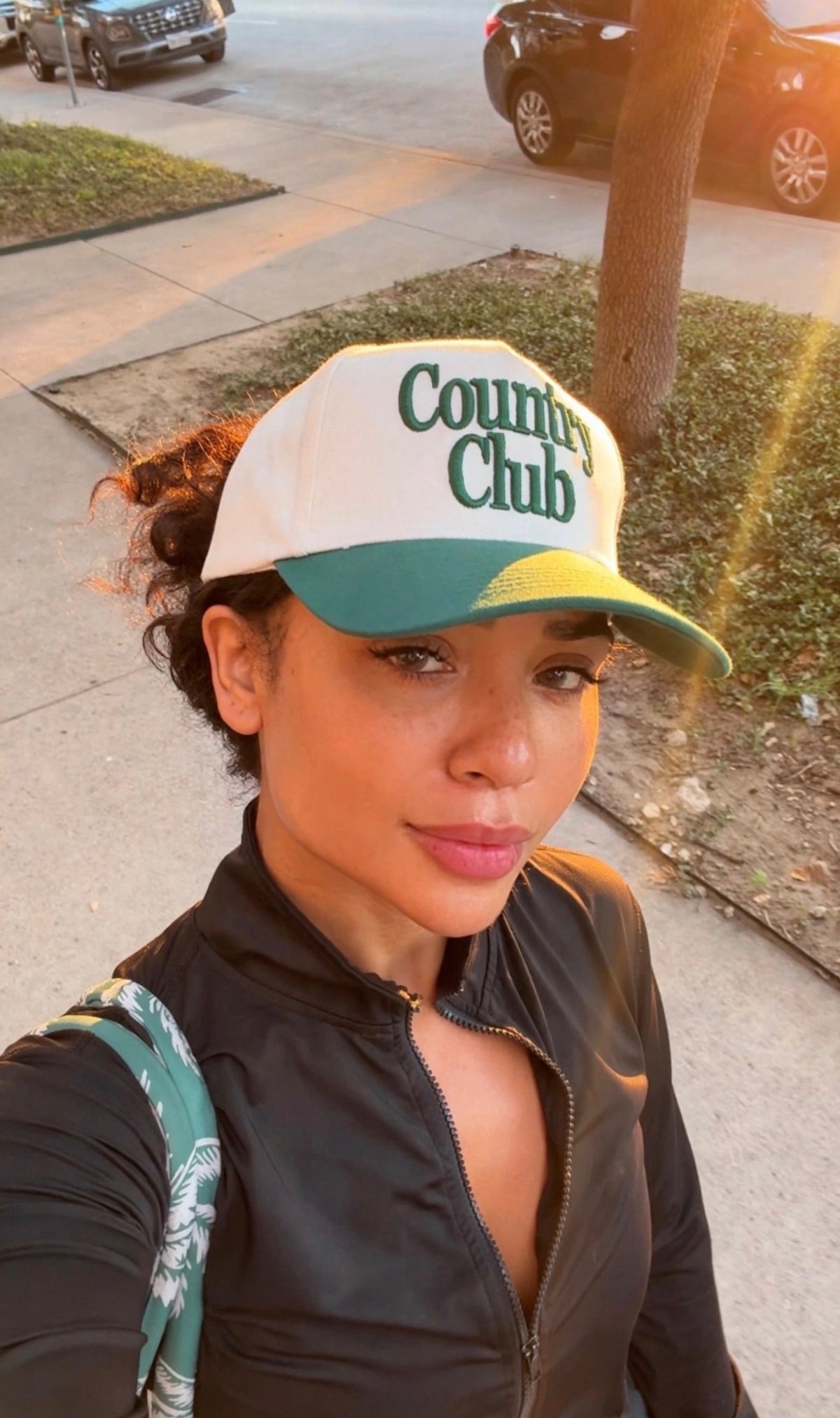 Destenee wearing the cream and green Country Club hat
