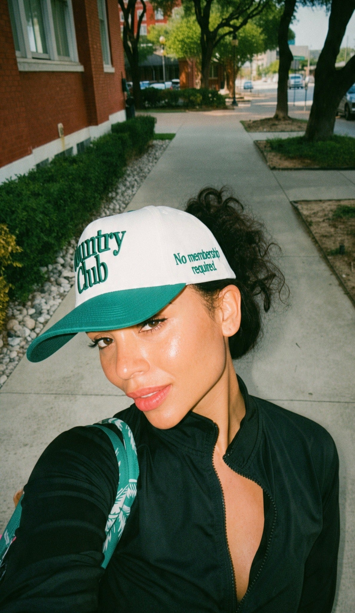 Destenee wearing the cream and green Country Club hat side view